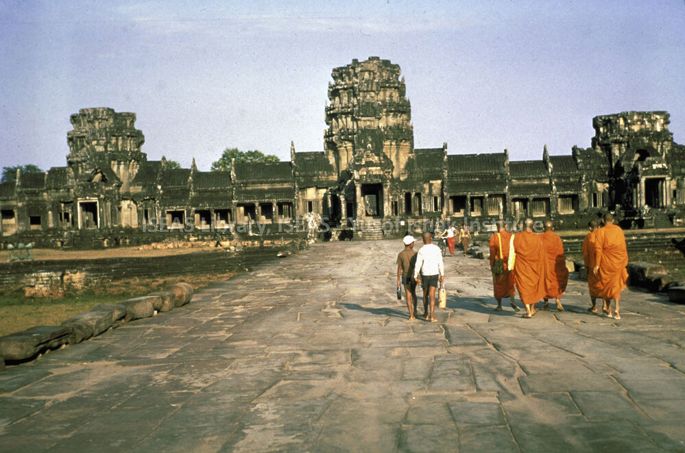 DP101_31 - A view of Buddhist monks approaching Angkor Wat, Angkor, Cambodia