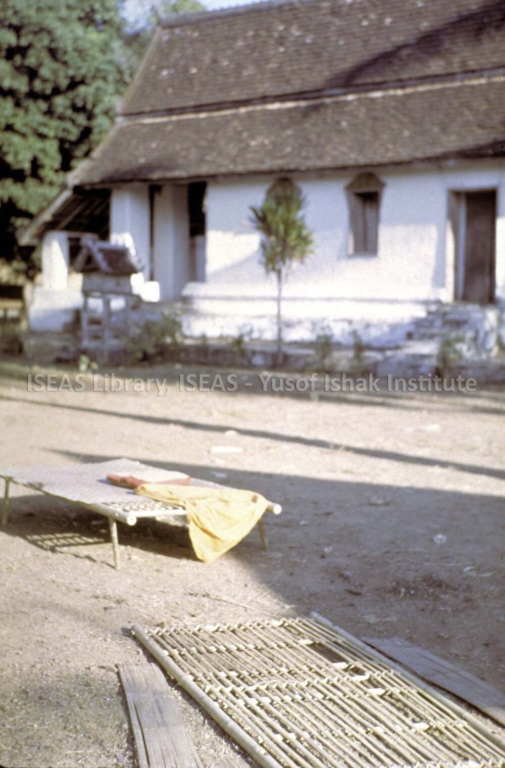 DP19_13 - A snapshot of a white-walled house a village in the vicinity of Luang Prabang, Laos.